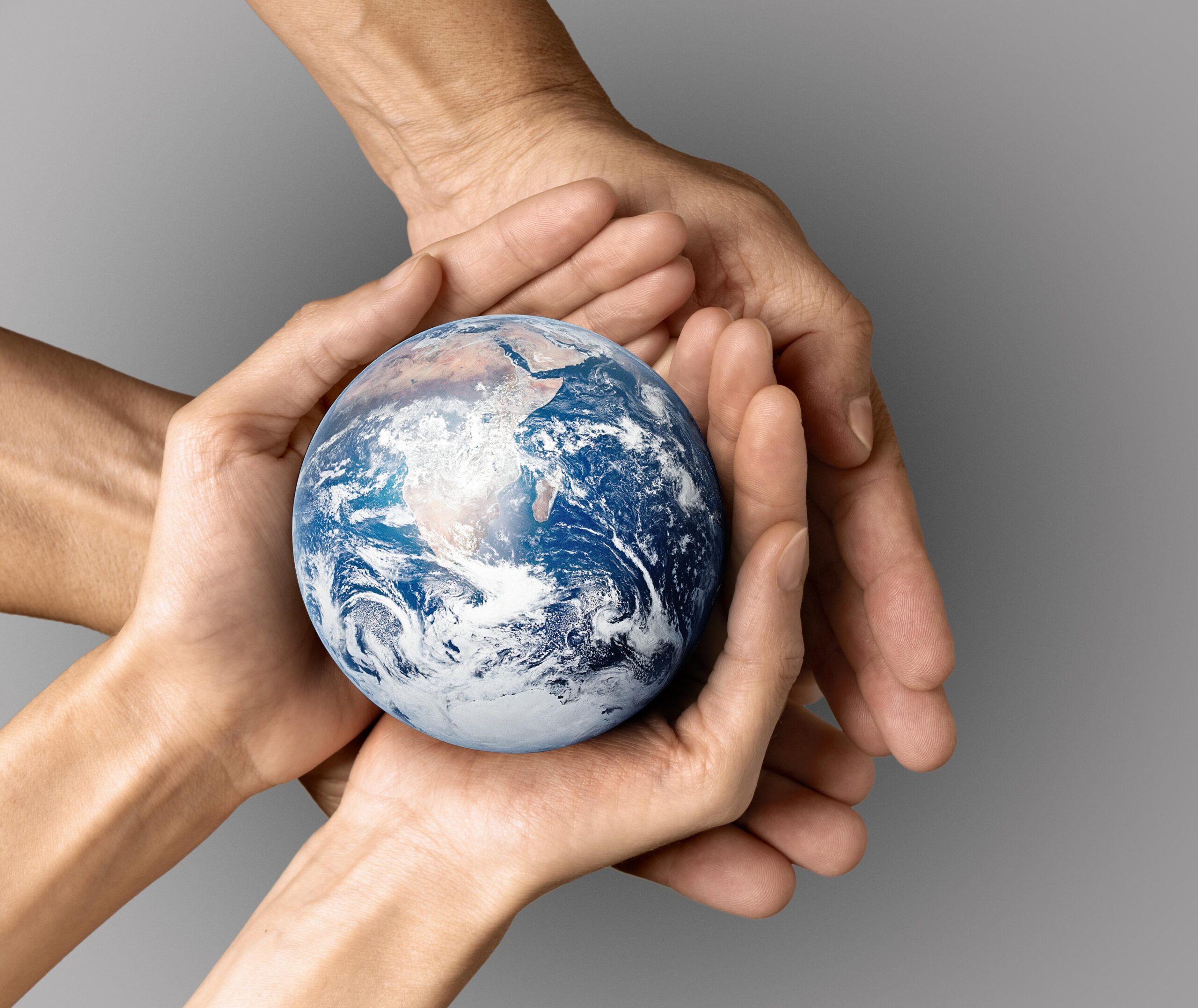 people-holding-earth-their-hands